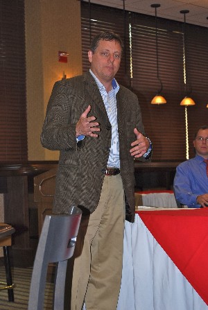 Dr. John S. Morgan, command science adviser for the U.S. Army's Special Operations Command, addresses the chapter in July.